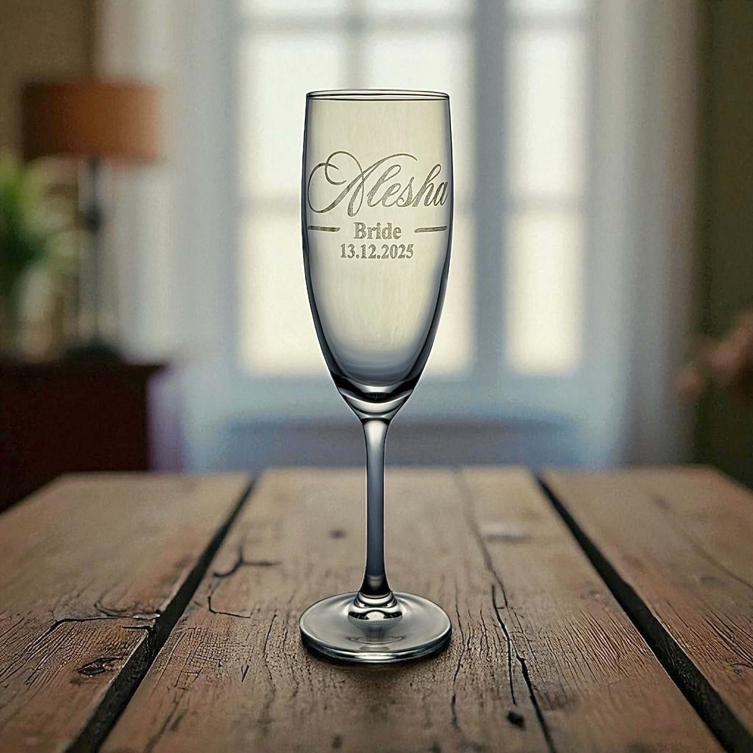 Personalised Mr & Mrs champagne glasses displayed as a keepsake wedding gift set.