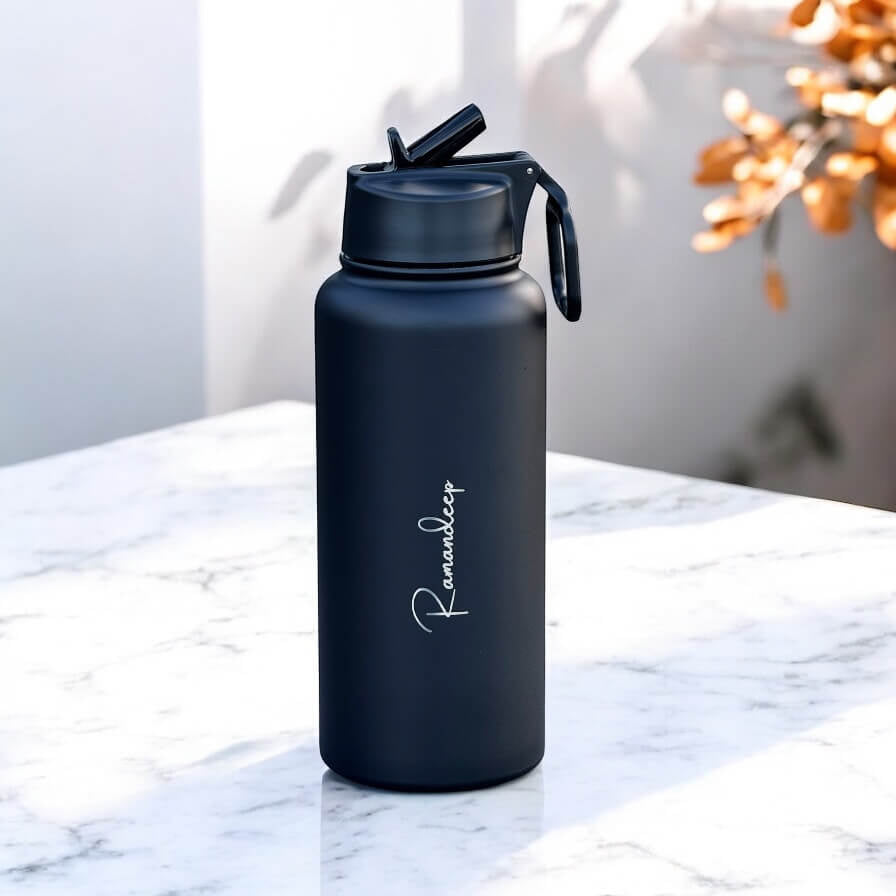 Side view of bottle showing straw and sleek cylindrical shape