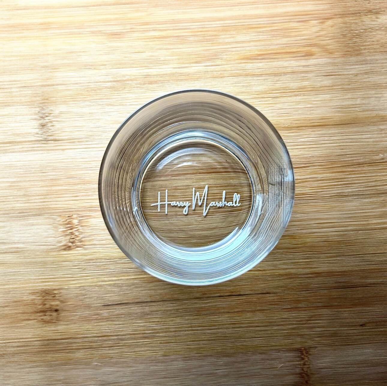 Top-down view of the glass highlighting precise laser-engraving on the base
