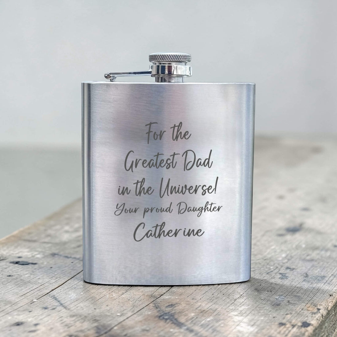 Personalised stainless steel hip flask engraved with a message for dad, a Father's Day gift idea for grandad from the family