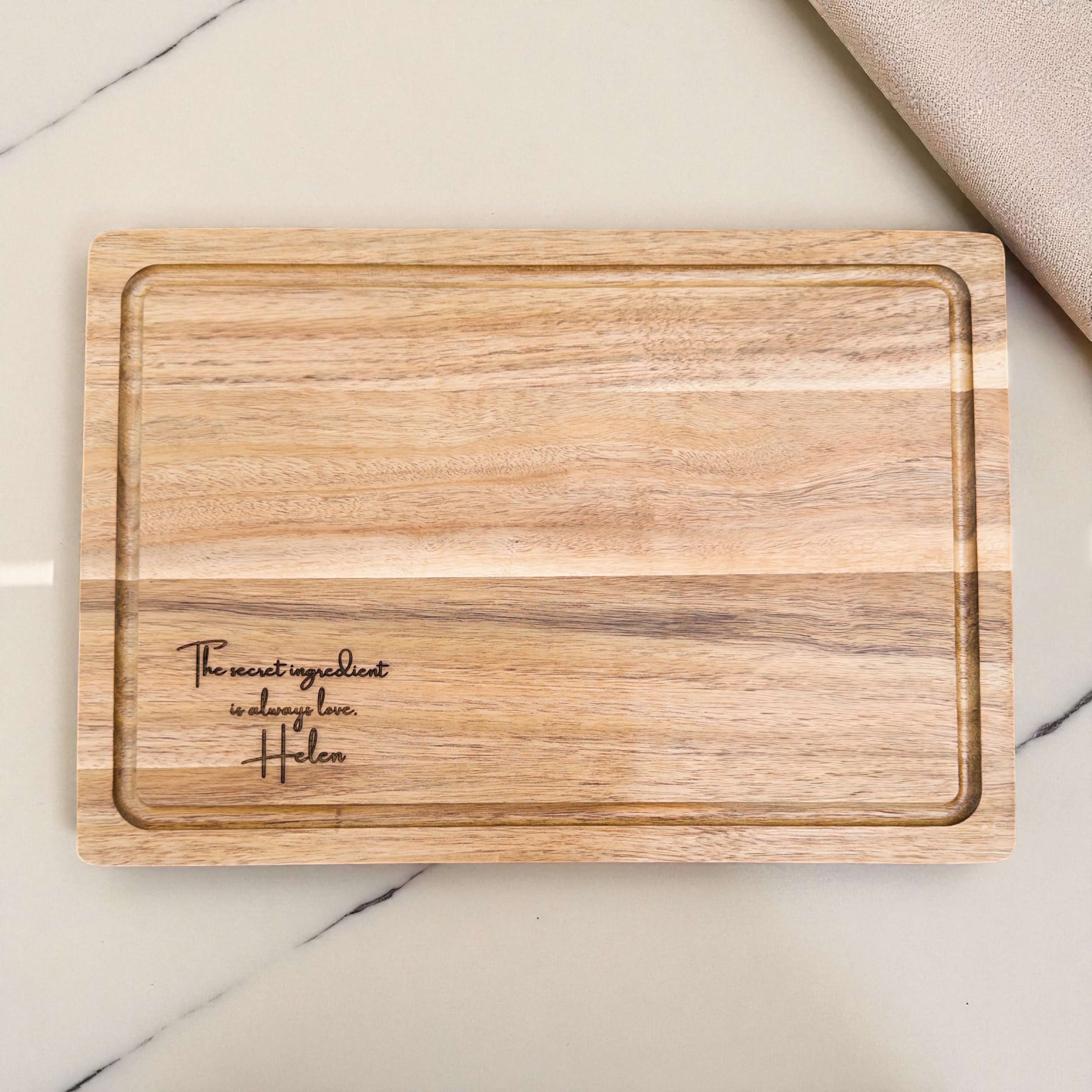 Custom engraved acacia chopping board featuring heartfelt message, personalised kitchen gift for family, mum, or friend who loves cooking.