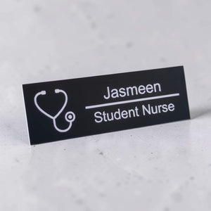 Angled personalised name badge with stethoscope icon and engraved role text