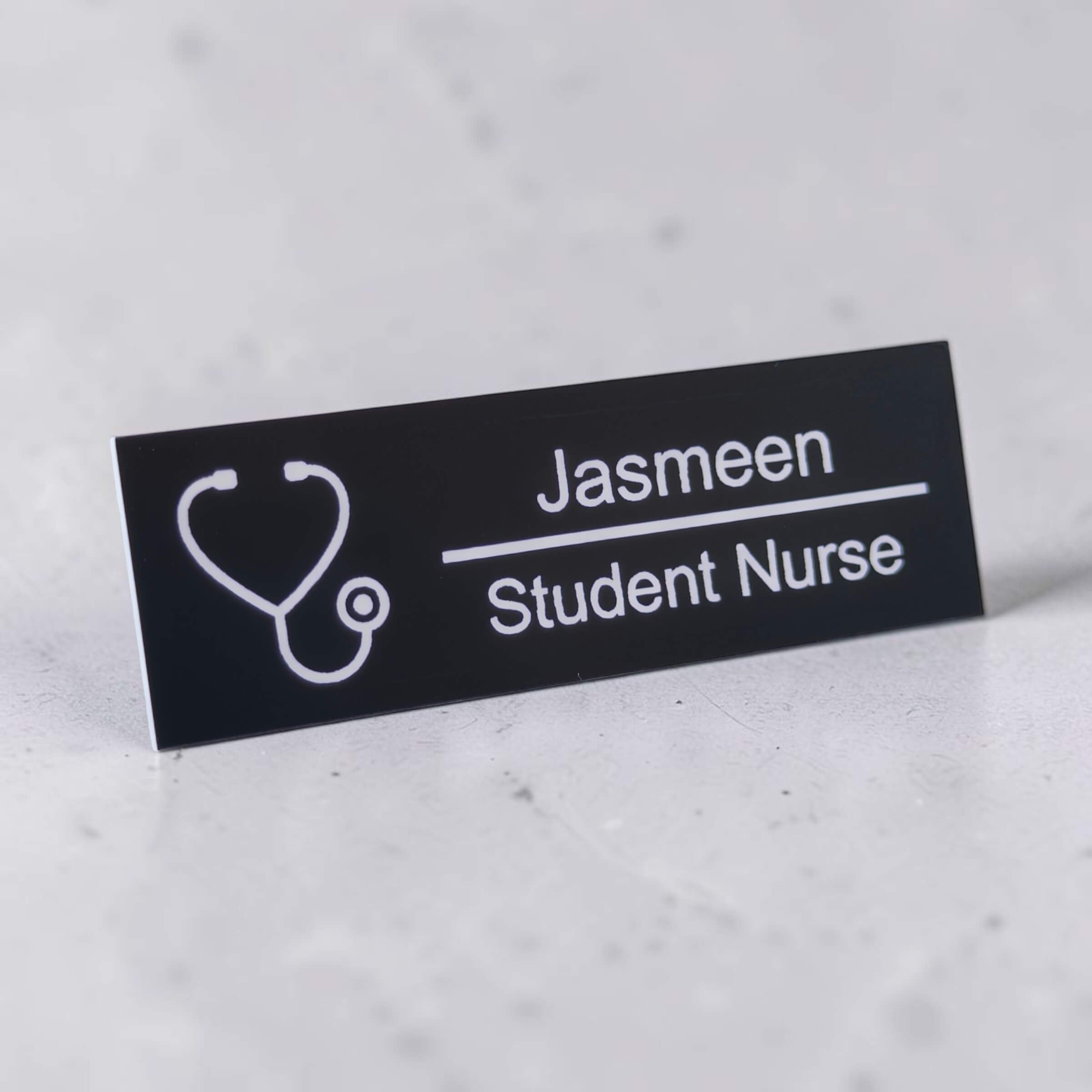Angled personalised name badge with stethoscope icon and engraved role text