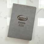 Angled view of professional grey A4 journal with engraved branding and personalisation, great for business events, client gifts, or employee milestones.