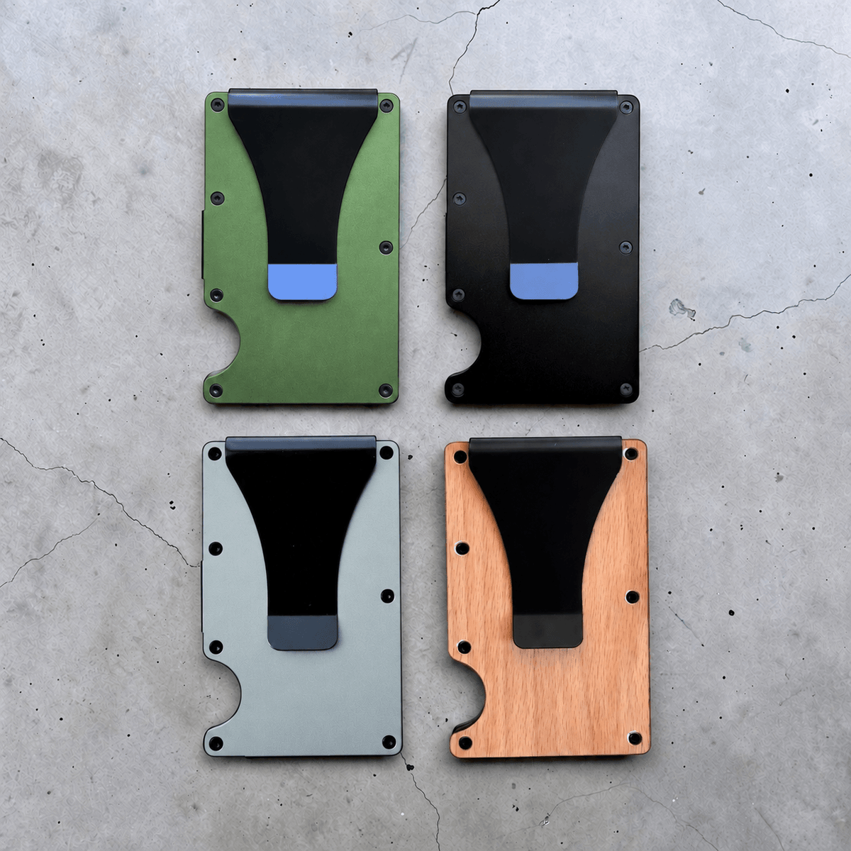 Back view of four slim card holders with money clips in green, black, light blue and wood finish