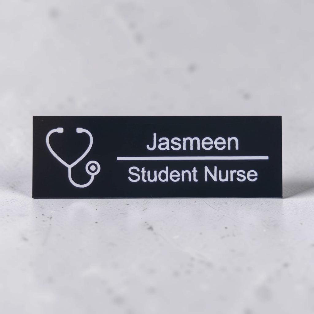 Black acrylic nurse name badge engraved with Jasmeen and Student Nurse