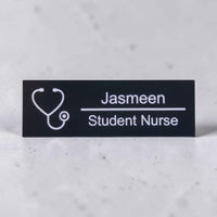 Black acrylic nurse name badge engraved with Jasmeen and Student Nurse