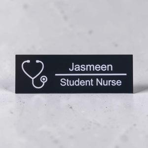 Black acrylic nurse name badge engraved with Jasmeen and Student Nurse
