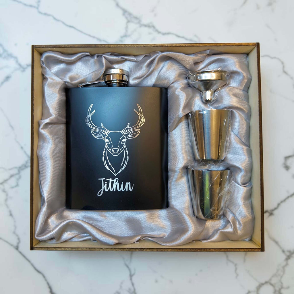 Black engraved hip flask gift set with stag design, Jithin name, funnel and cups in wooden box