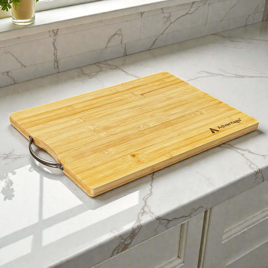 Branded bamboo chopping board with engraved company logo and stainless steel handle on marble kitchen bench, corporate promotional gift