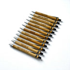 Branded bamboo pens with engraved names, neatly arranged on a white background for business promotions.