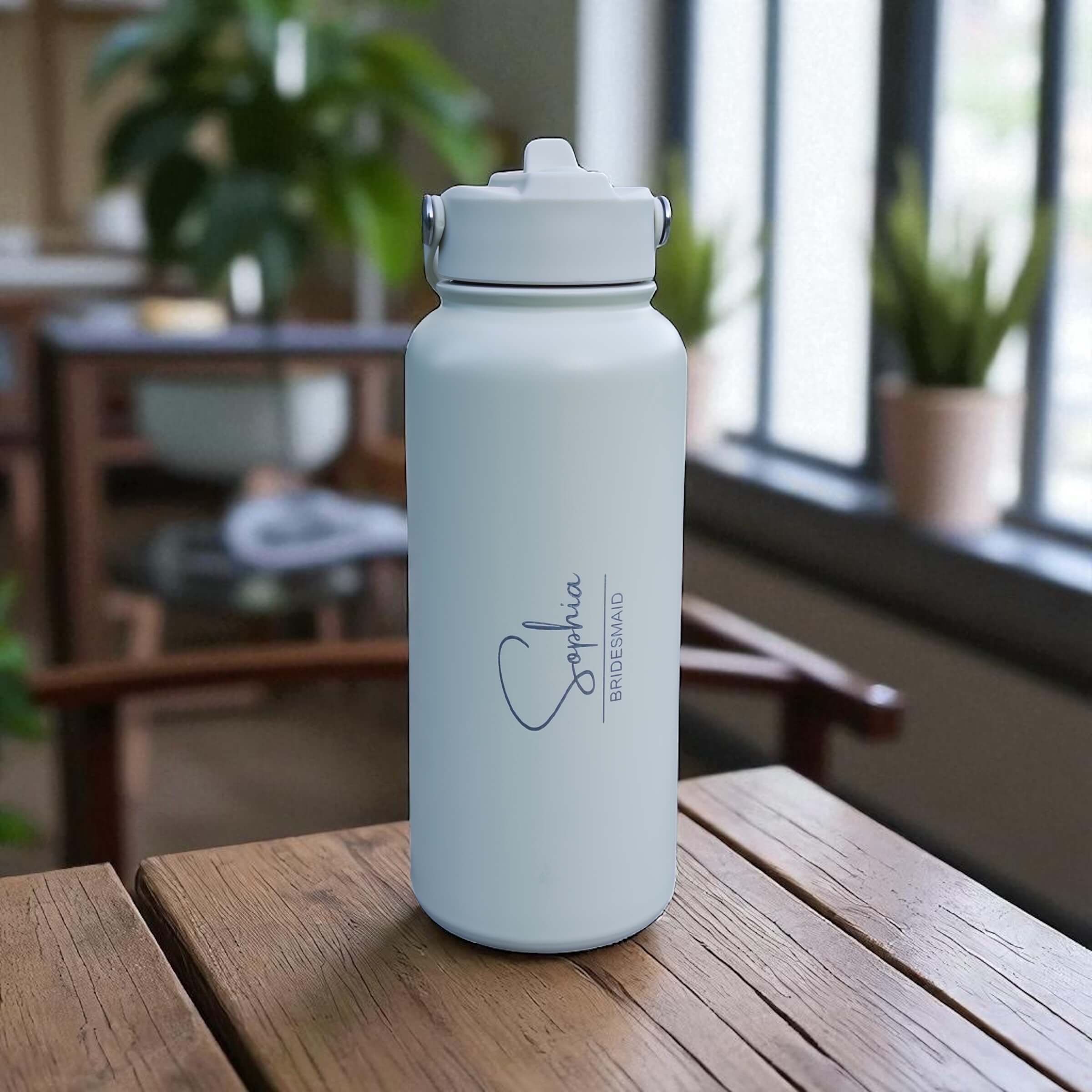 Bridesmaid gift water bottle engraved with name and title.