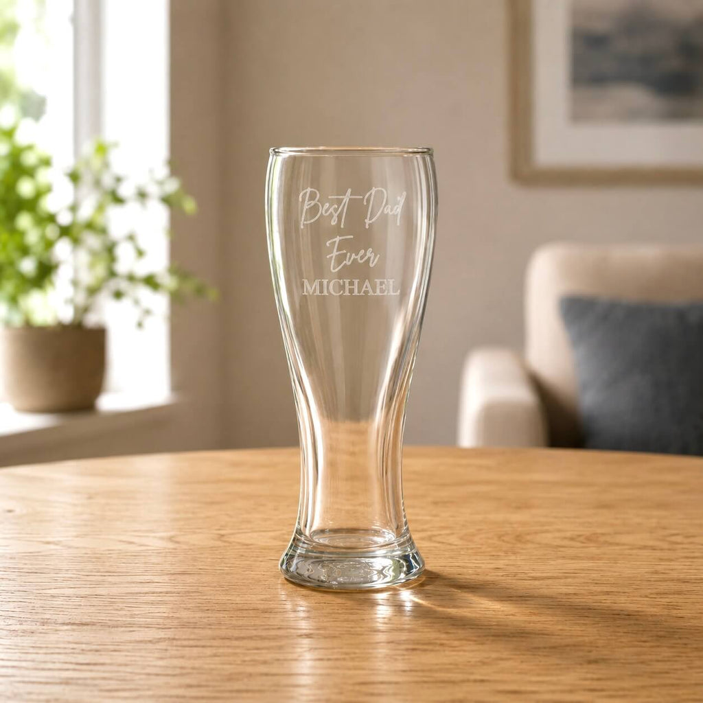 Clear 425ml beer glass with etched Dad message in a warm home setting