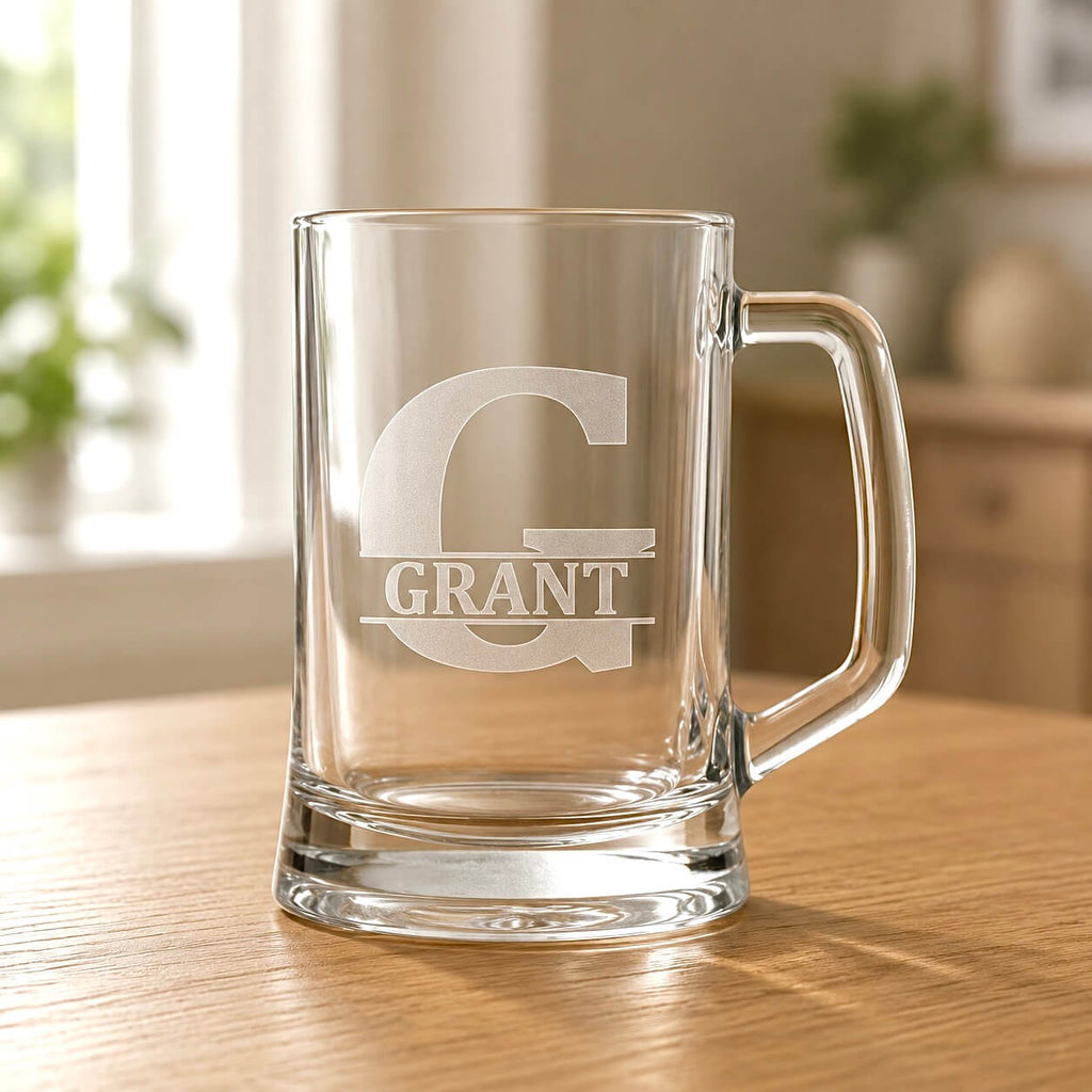 Clear beer mug with engraved Grant name and large G initial on wooden table