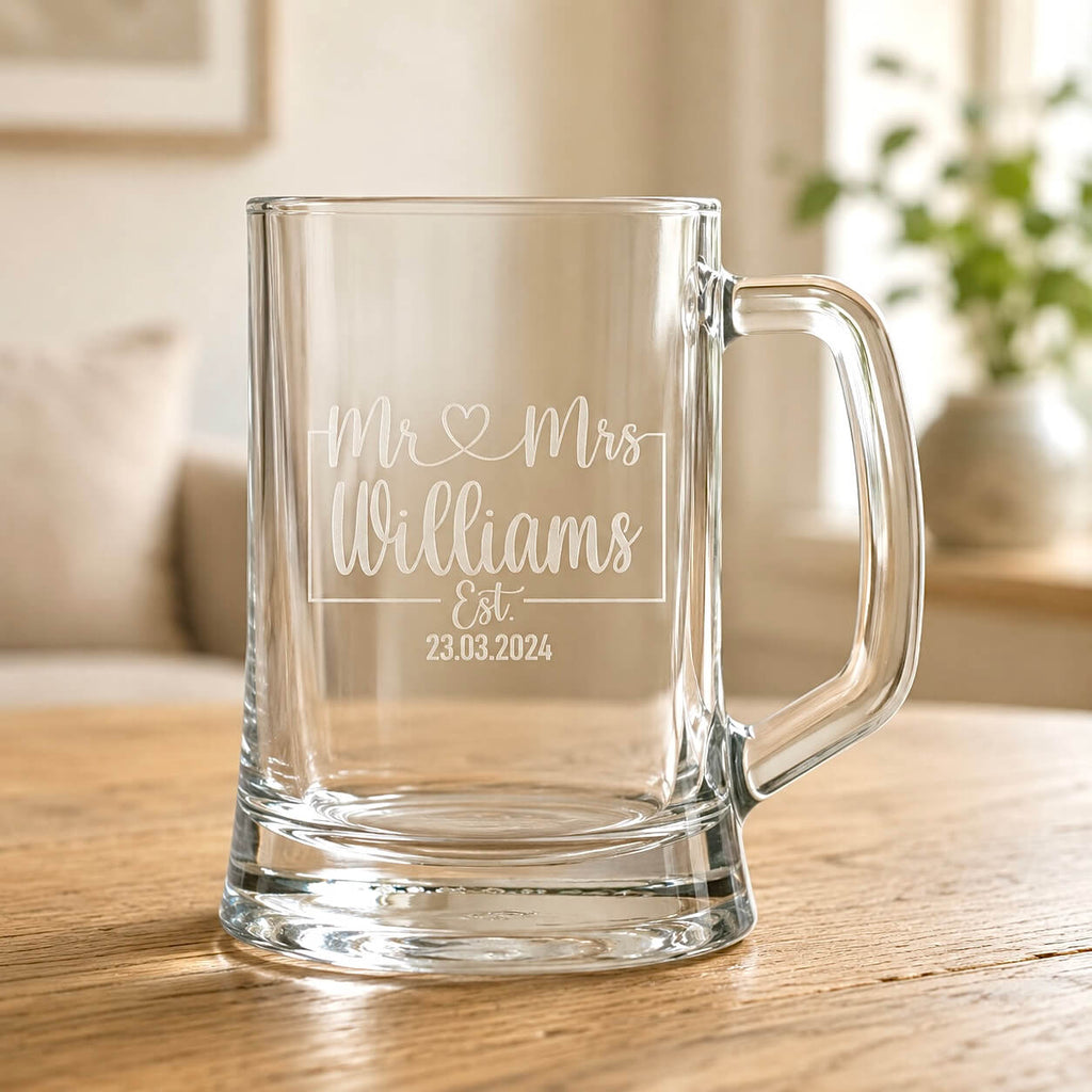 Clear beer mug with engraved Mr and Mrs Williams wedding date on wooden table