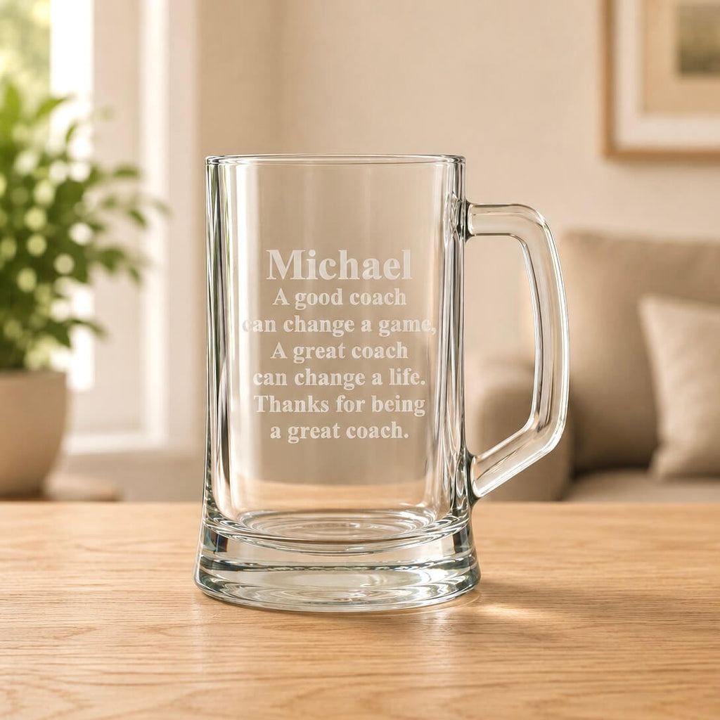 Clear beer mug with frosted coach message engraving and handle on the right