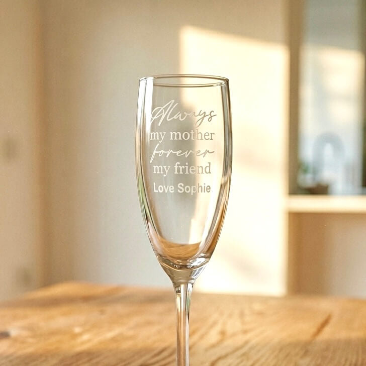 Close-up of custom engraved champagne flute for Mum with "Always my mother, forever my friend" engraving and personalised name