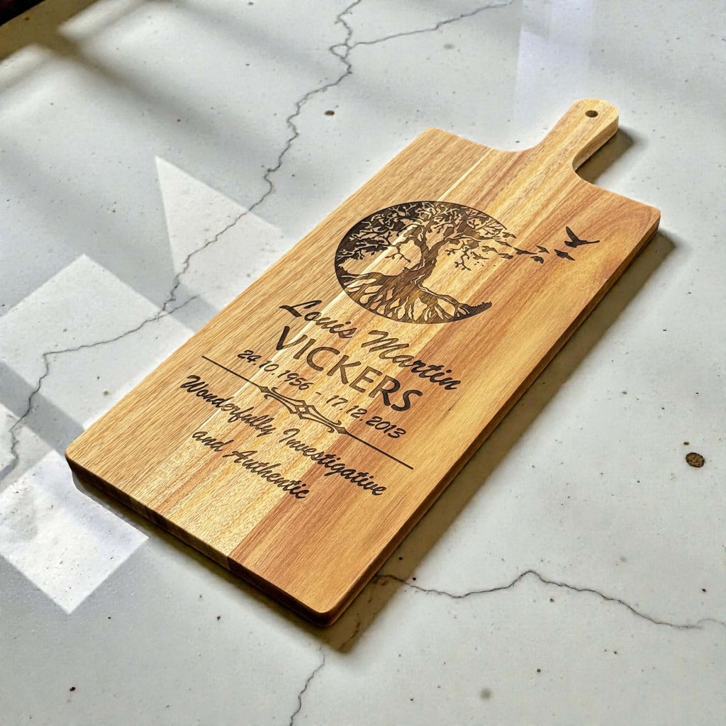 Close-up of custom engraved name and remembrance dates on a wooden memorial board