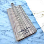 Close-up of custom engraving on Acacia wood serving board
