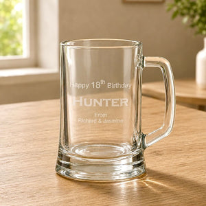 Close-up of engraved beer handle with Hunter 18th birthday design and clear glass base