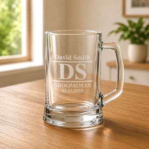 Close-up of engraved beer mug showing David Smith, DS initials and groomsman wedding date