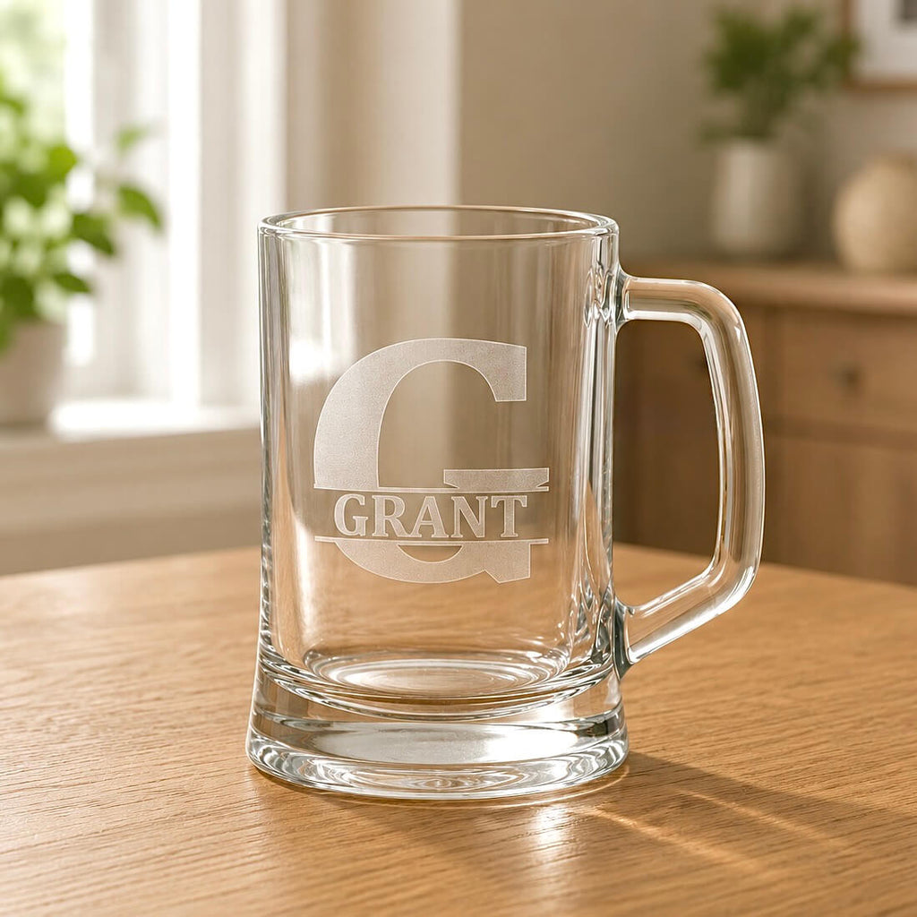 Close-up of engraved beer mug with Grant name, split G initial and warm home background