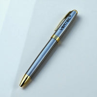 Close-up of engraved metal business pen showing custom logo detail