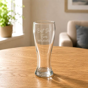 Close-up of engraved pilsner glass with Best Dad Ever text and clear rounded base