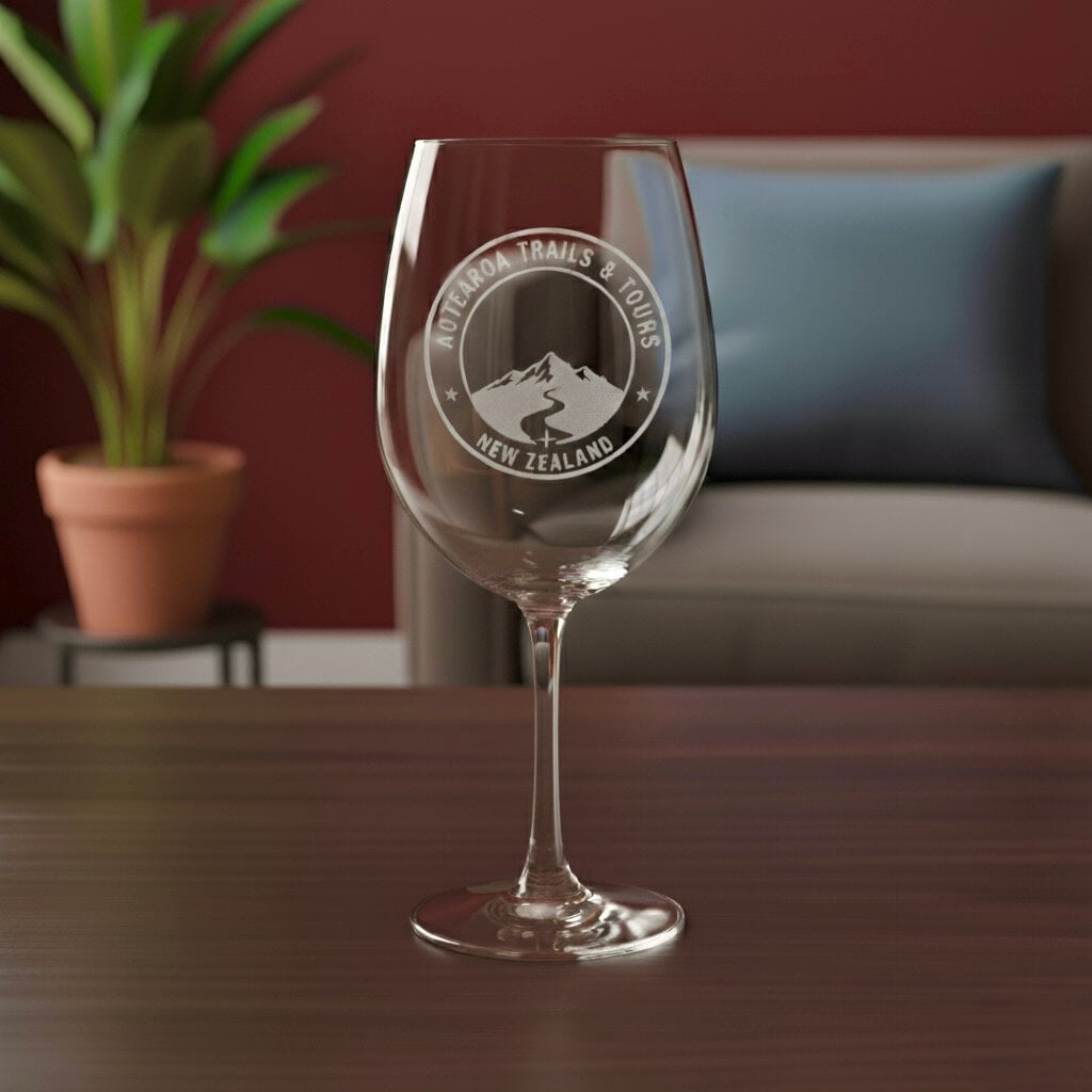 Close-up of laser-engraved wine glass with company branding, ideal for corporate events.