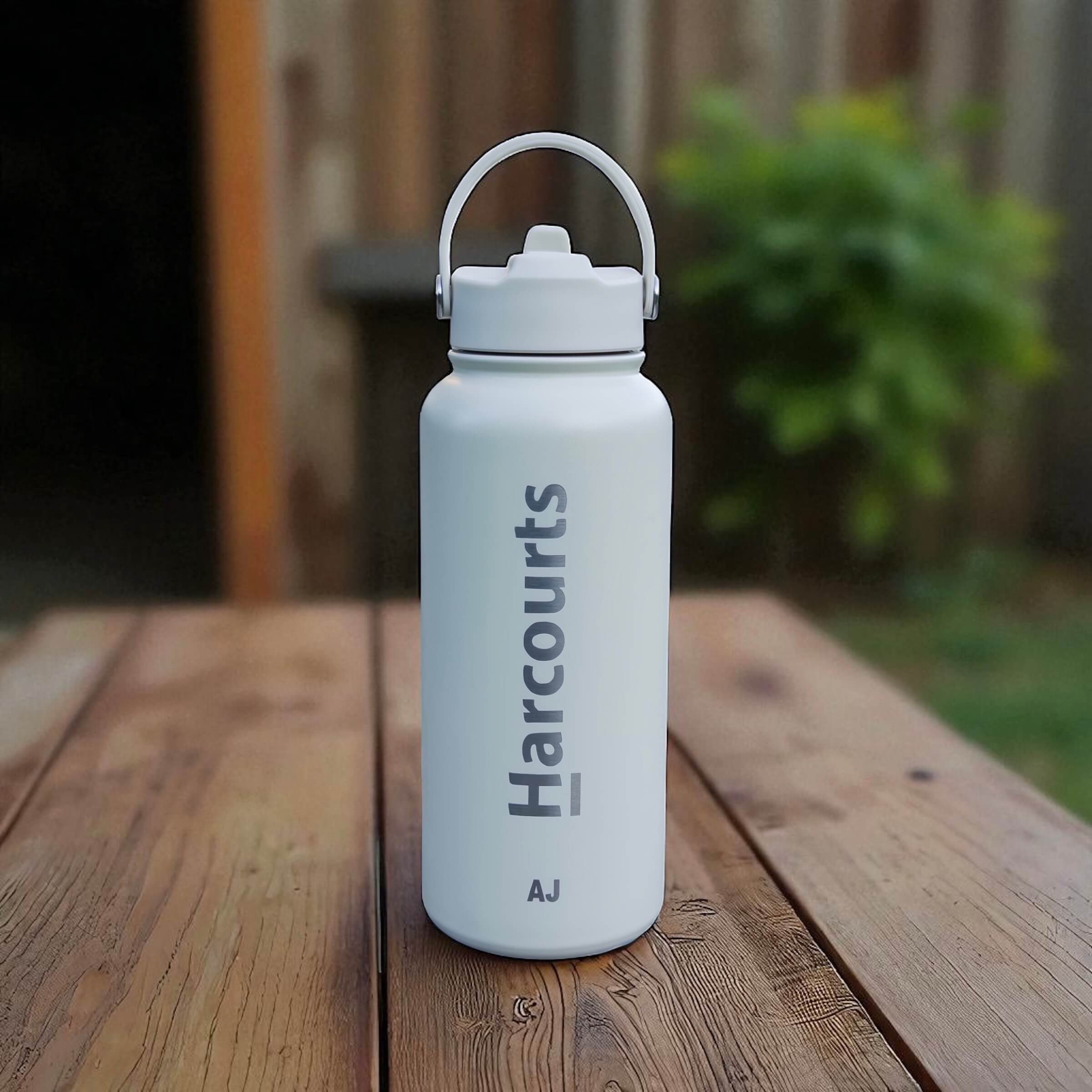 Close-up of laser engraved detail on insulated stainless steel bottle for business.