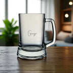 Close-up of laser engraving on glass showing message or name