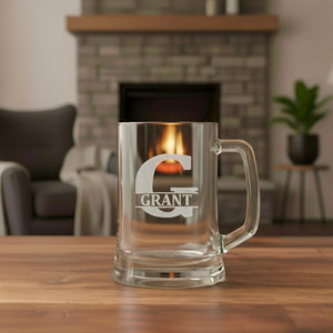 Close-up of personalised beer mug featuring engraved G initial and Grant name, custom glass gift for men