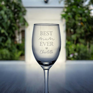Close-up of personalised wine glass with name engraved