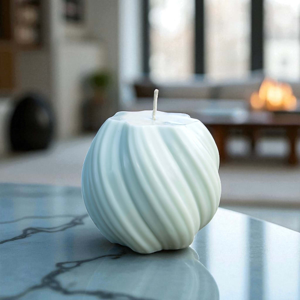 Contemporary sculptural candle featuring elegant swirl lines, ideal for home decor or gifting.