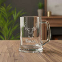 Custom engraved antler beer mug with Roman name, premium clear glass gift displayed in cosy home setting