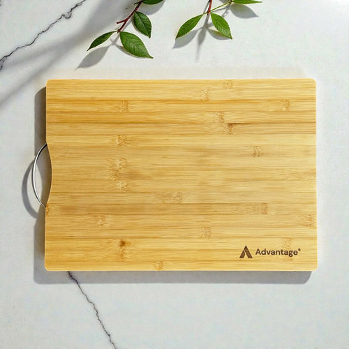 Custom engraved bamboo chopping board with Advantage logo and stainless steel handle on marble surface, branded corporate gift