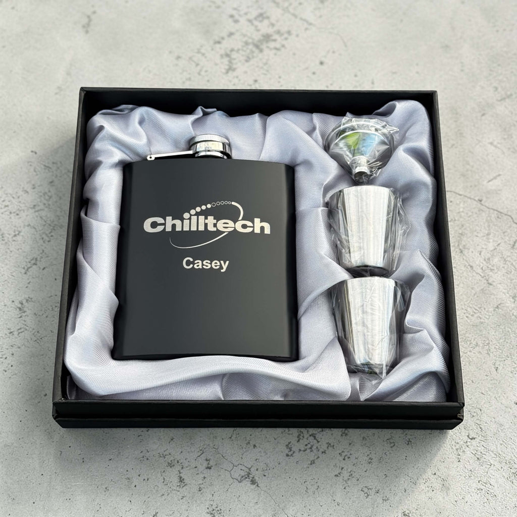 Custom engraved black stainless steel hip flask gift set in satin lined box with shot glasses and funnel, branded corporate gift