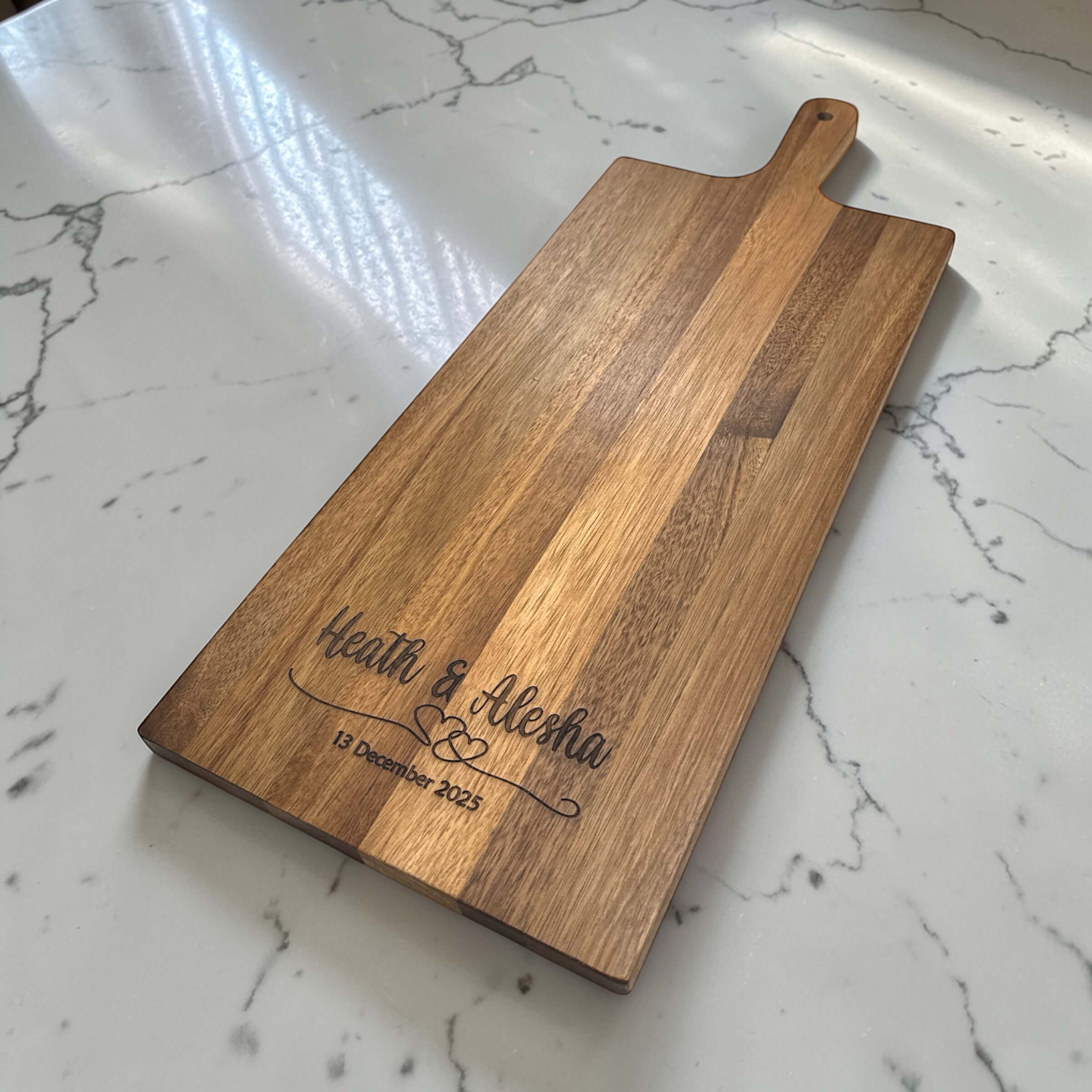 Custom engraved long wooden paddle serve board with couples names and date, personalised wedding gift acacia wood