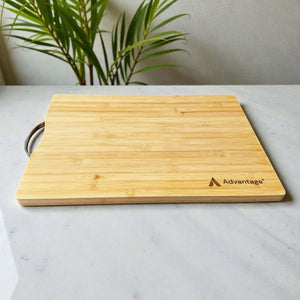 Custom laser engraved bamboo cutting board with stainless steel handle, personalised corporate gift with company logo on marble surface