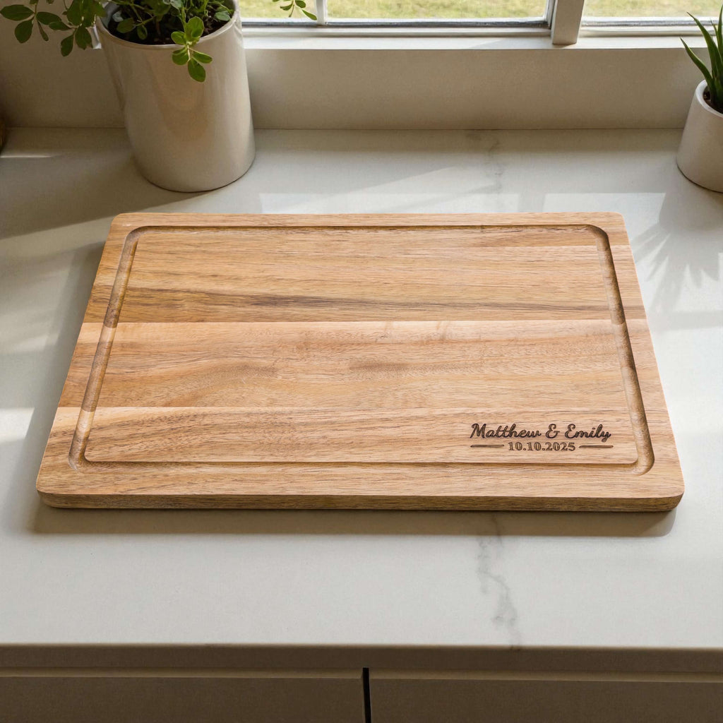 Custom wedding chopping board made from sustainable acacia wood, engraved with couple names and date, ideal for kitchen or home decor gift.