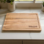 Custom wedding chopping board made from sustainable acacia wood, engraved with couple names and date, ideal for kitchen or home decor gift.