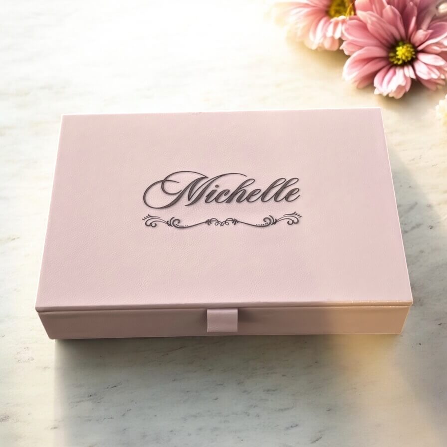 Elegant personalised jewellery box gift idea for her, photographed with soft floral accents.