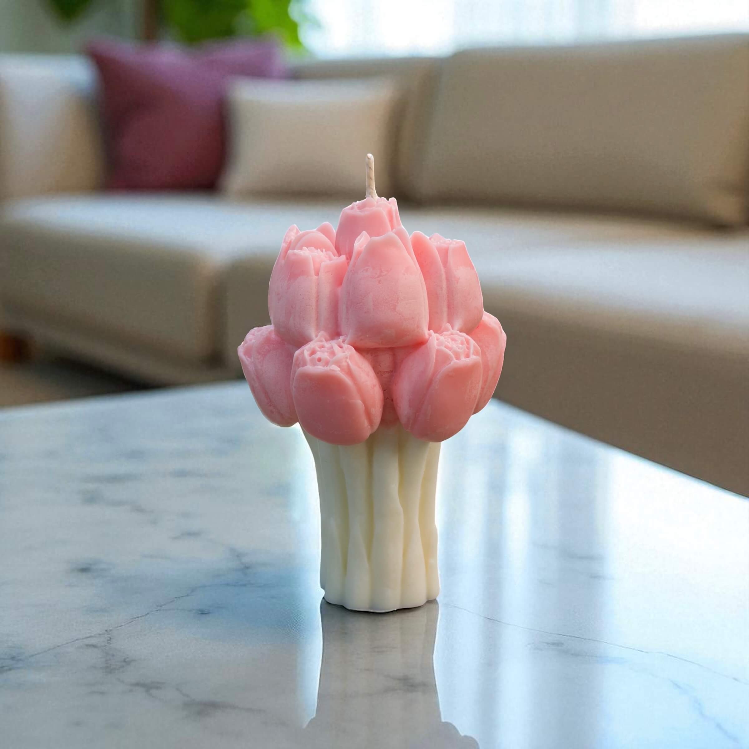 Elegant tulip flower candle with pink petals and white base, styled as a decorative home fragrance piece.