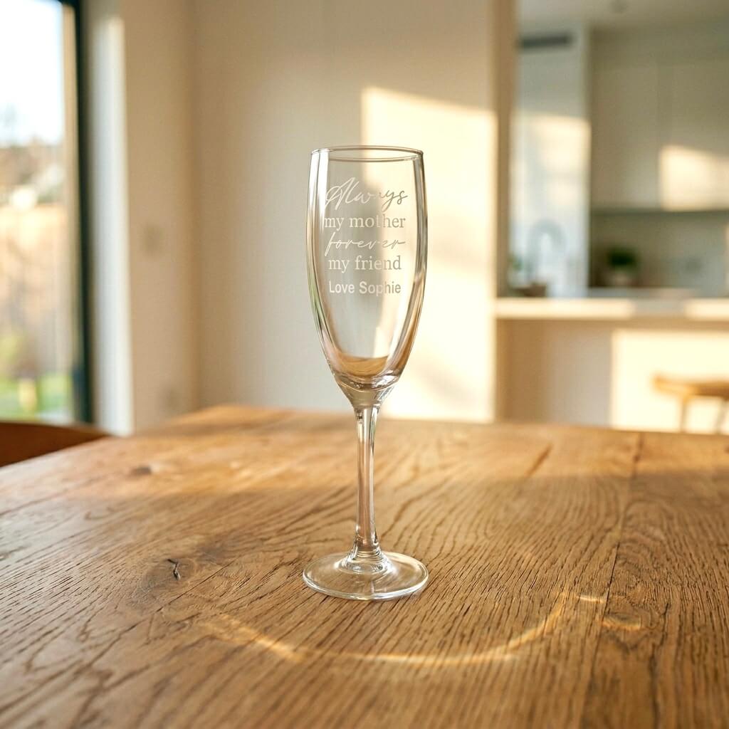 Engraved Mum champagne flute gift featuring heartfelt script and custom signature, styled on a rustic oak dining table