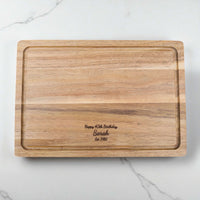 Engraved acacia wood chopping board featuring birthday message and name, personalised kitchen gift idea for 40th birthday celebrations.