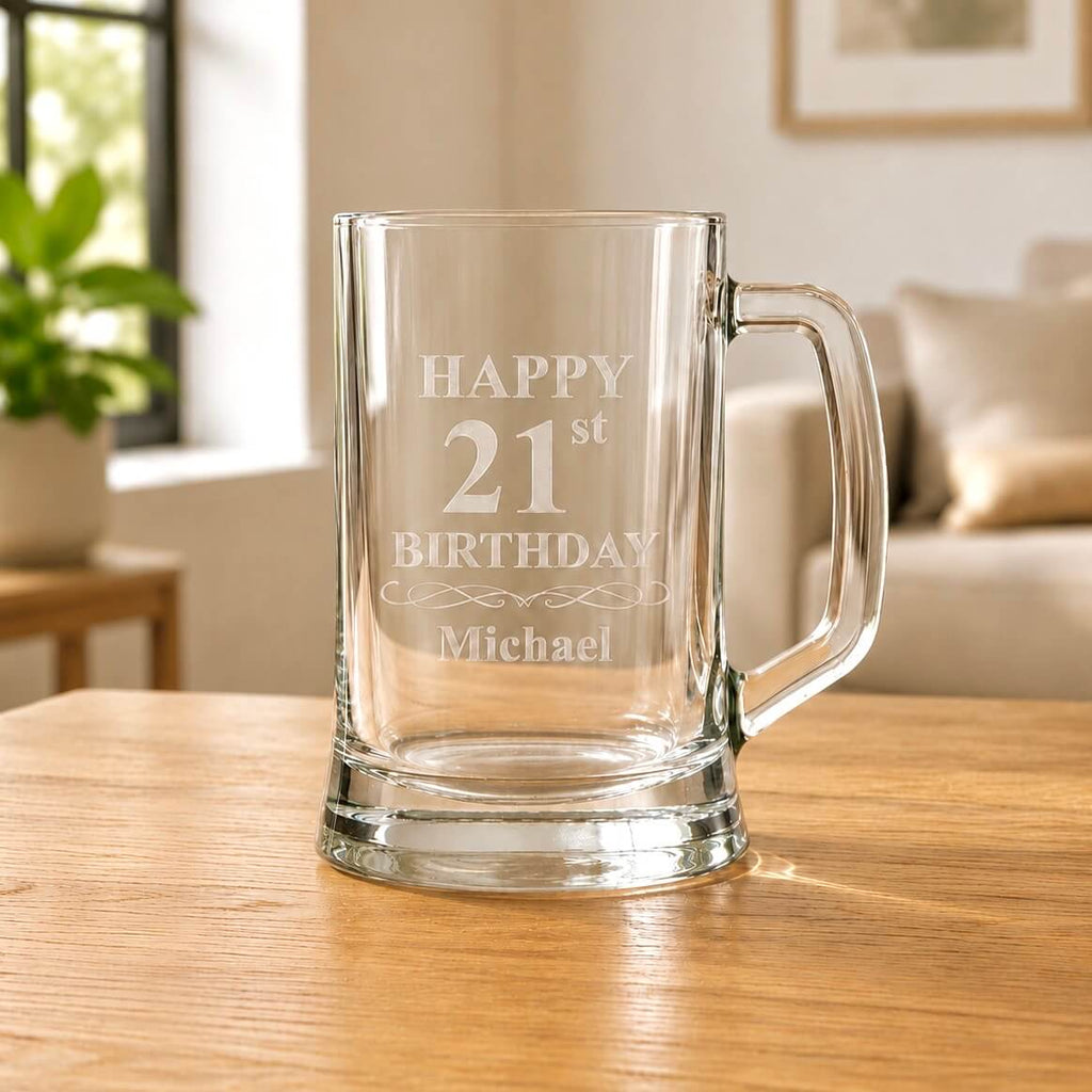 Engraved beer mug with “Happy 21st Birthday Michael” design, thick base and clear handle on an oak table