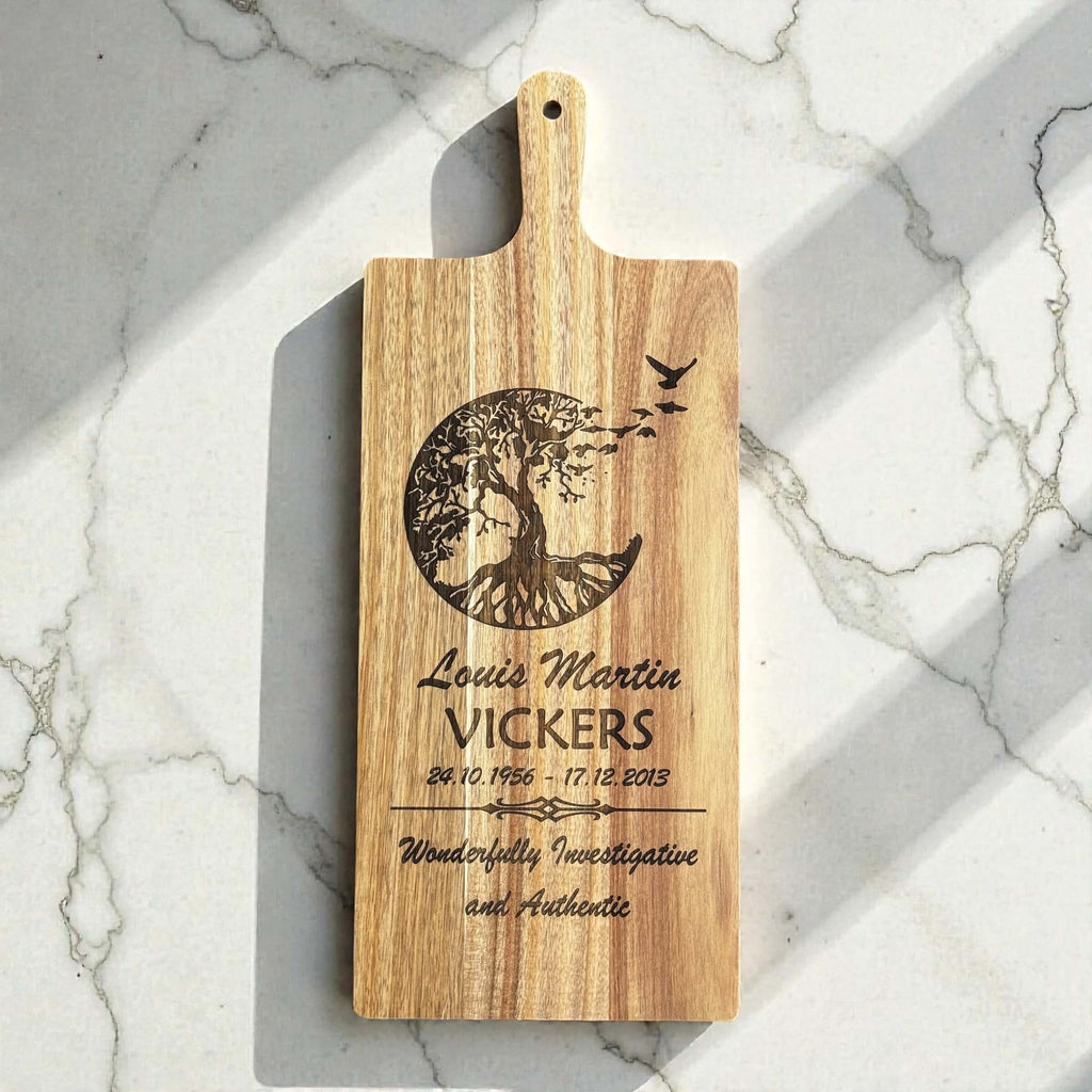 Engraved memorial wooden board with tree of life design, name, dates, and tribute message