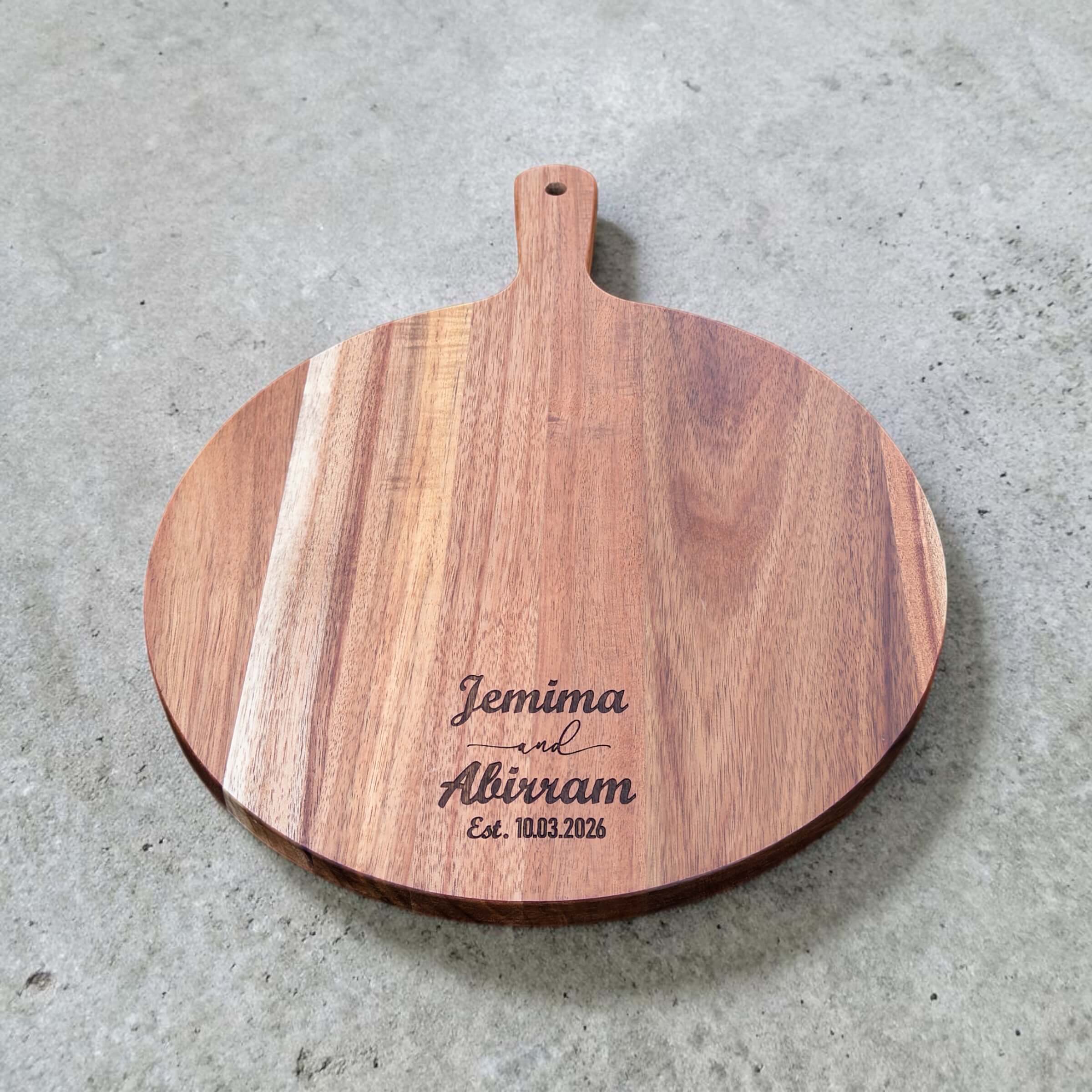 Engraved round paddle board with handle and custom couple engraving for anniversary gift