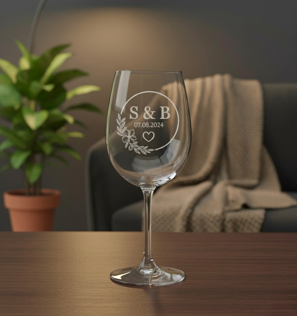 Engraved wedding wine glass with initials S and B and wedding date in floral circle design