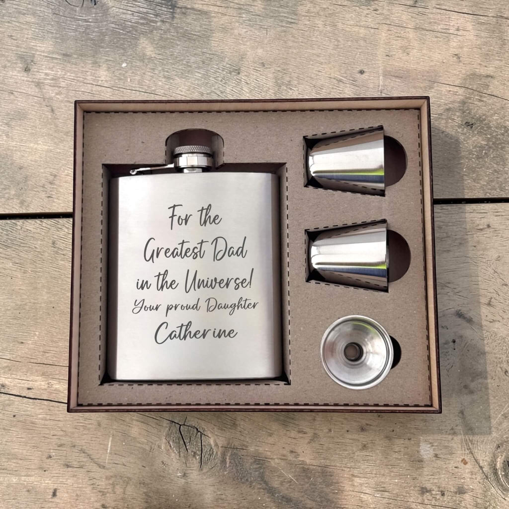 Flask set with engraved message for dad in a wooden box gift set on a wooden surface